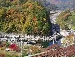 Nezame-no-Toko, a nationally designated scenic gorge on the Kiso River (Kiso Eight Views), with pale rock and emerald water and an Urashima Taro legend.