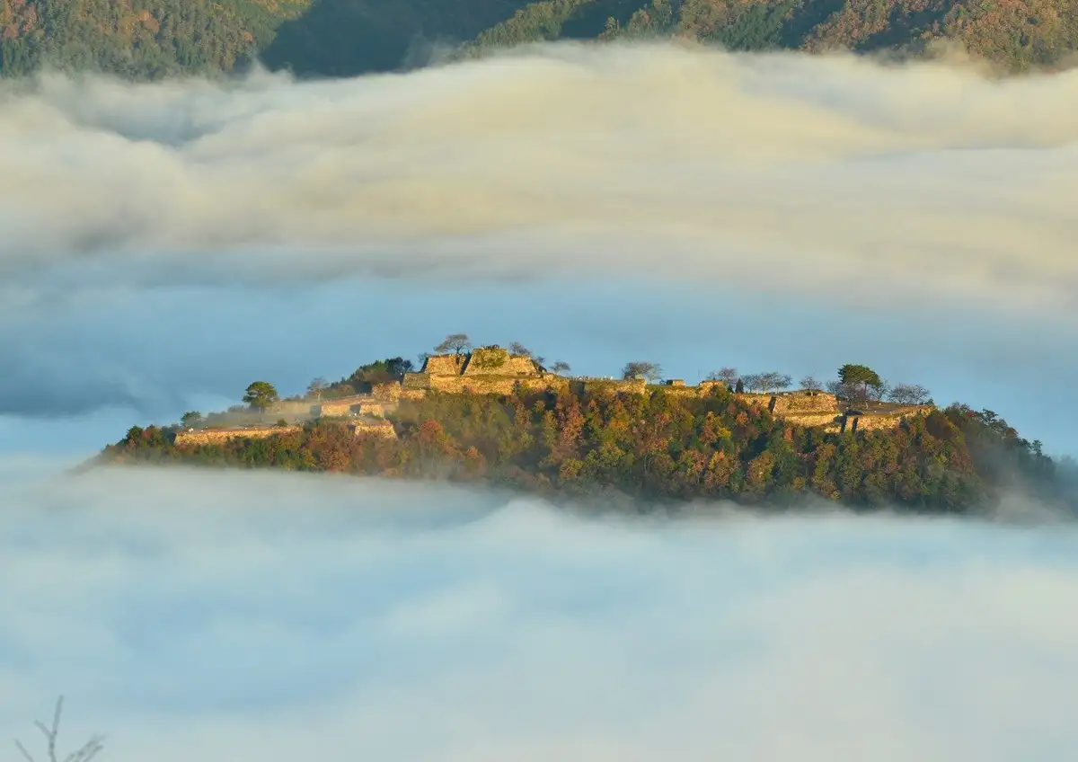 Stone walls of Takeda Castle ruins above the clouds