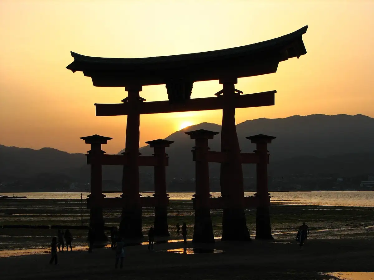 Itsukushima Shrine torii at sunset